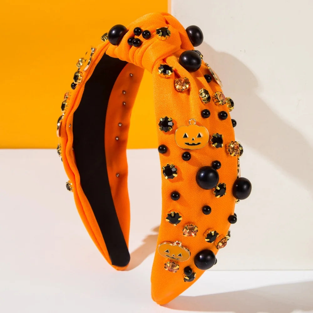Bright orange Halloween headbands for women featuring decorative pumpkins and shiny embellishments