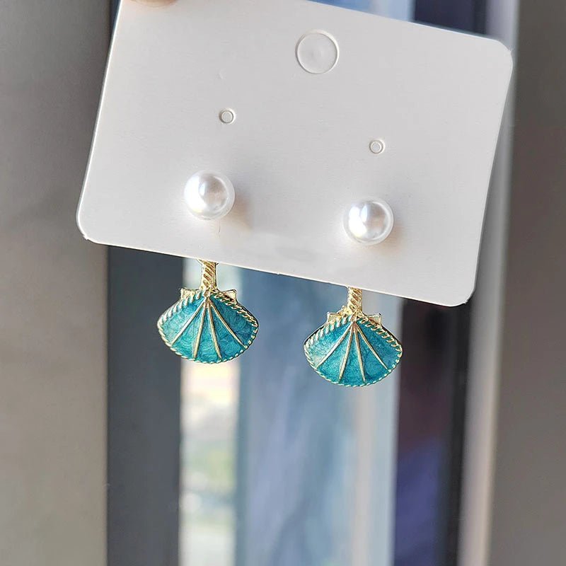 EtherealBe blue shell pearl dangle earrings with pearl studs and intricate shell design