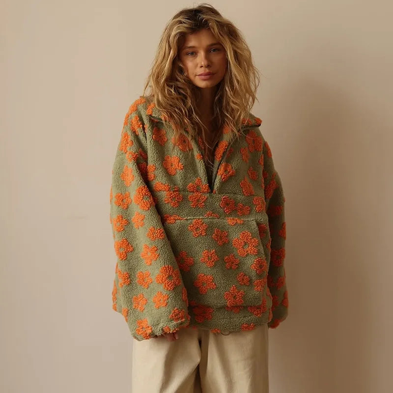 Cozy lambskin coat for women featuring a stylish floral pattern in orange and green colors