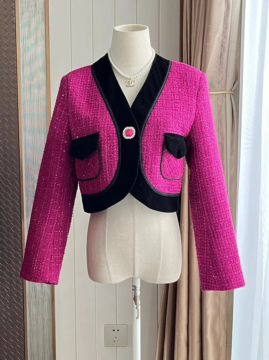 Stylish sweet pink tweed blazer for ladies with black accents and pockets, perfect for chic outfits