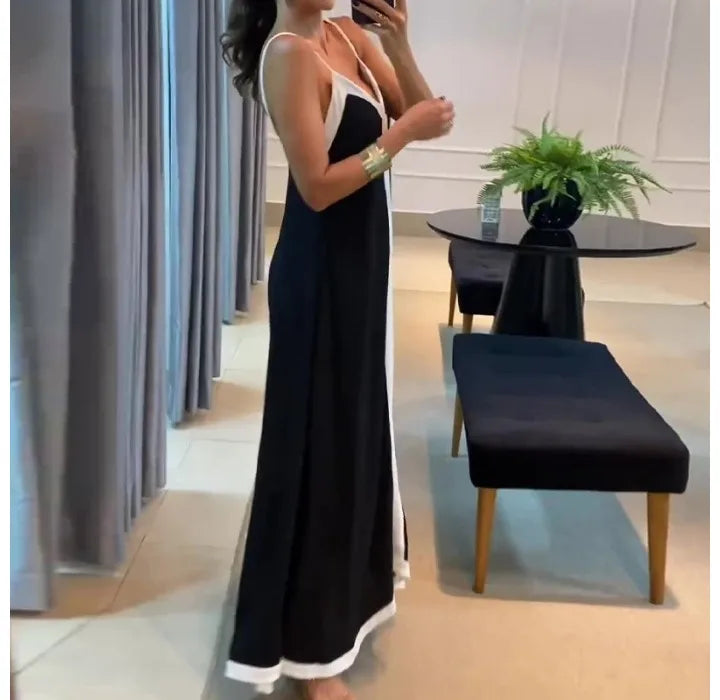 Stylish black and white sleeveless maxi dress with thin straps and elegant design