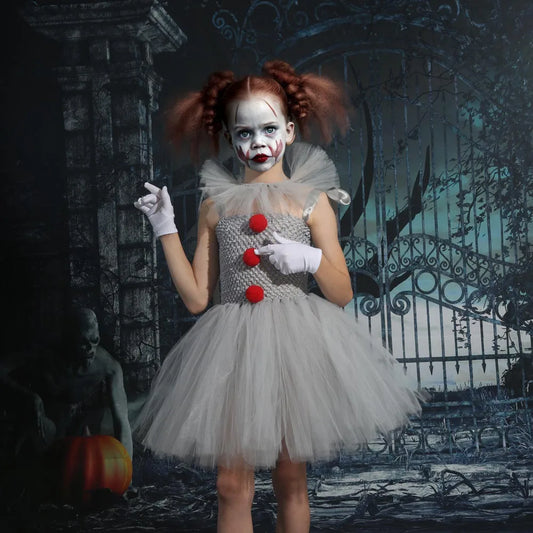 Girls wearing kids creepy clown Halloween costume with gray tutu and red pom-poms for spooky celebrations
