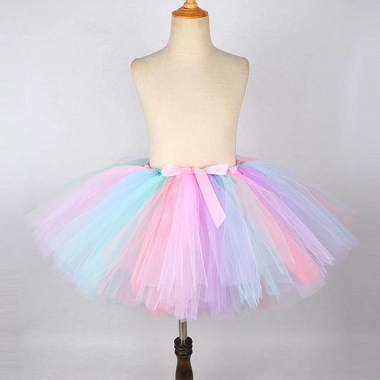Colorful kids unicorn Halloween costume with wings featuring a fluffy tulle skirt in pastel colors