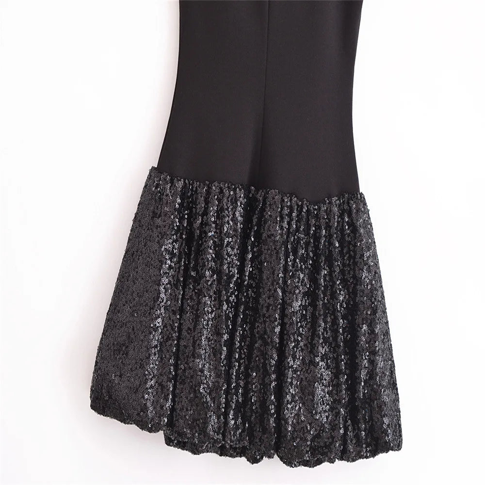 EtherealBe sleeveless chic cocktail dress with a sparkling sequin skirt for a stylish evening look