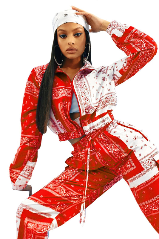 Model wearing red and white paisley bandana print tracksuit women with crop zip jacket and drawstring pants