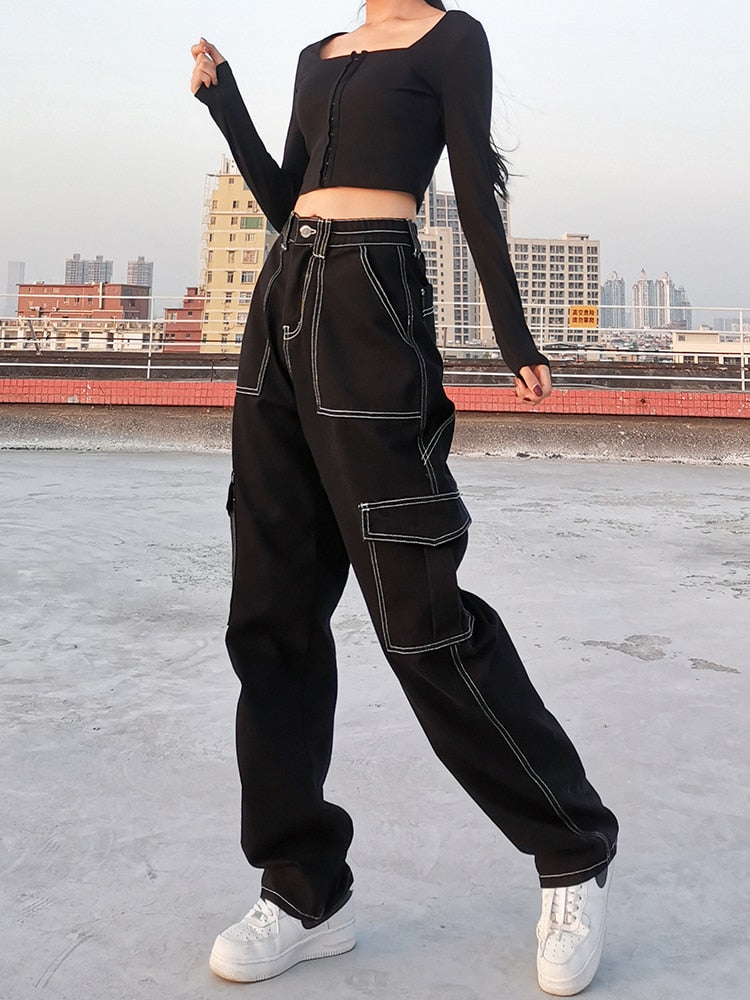 Model wearing EtherealBe black baggy cargo jeans for women with contrast stitching and cargo pockets