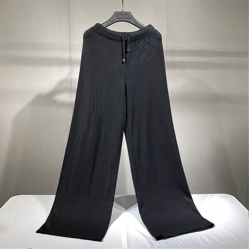 Black knit wide leg pants with drawstring waist on hanger chic wide leg sweater pants set relaxed drape