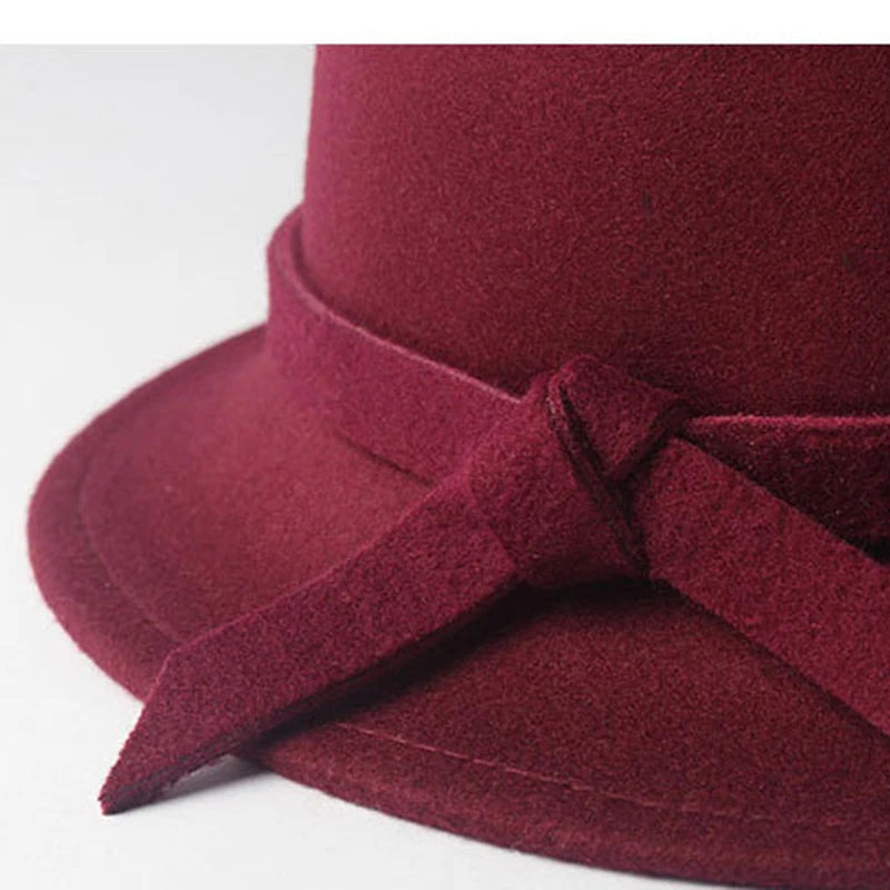 Burgundy bow bucket cap for women with a stylish design and soft texture