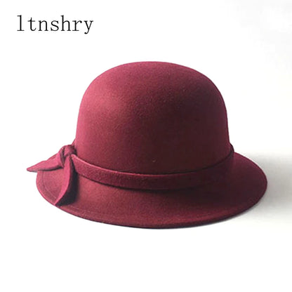 Maroon bow bucket cap for women featuring a stylish ribbon detail and soft fabric design
