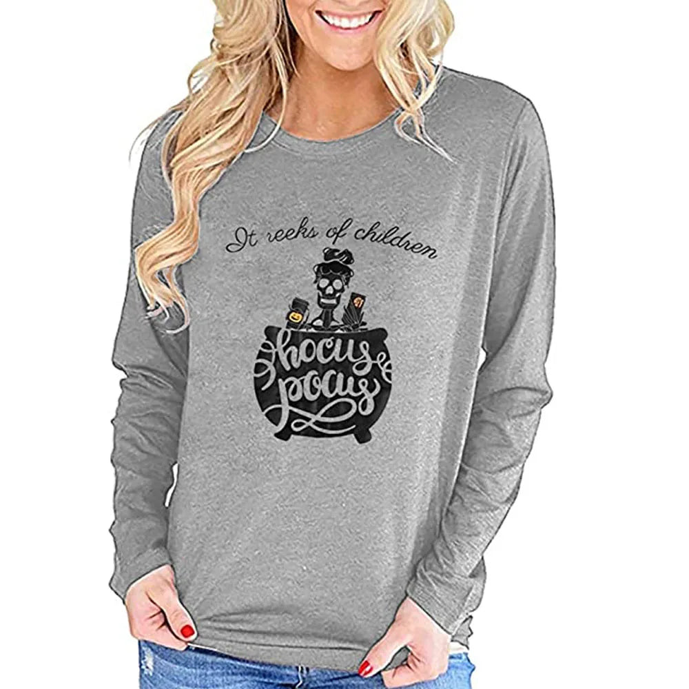 Womens Halloween shirt long sleeve featuring a playful design with a witch and cauldron