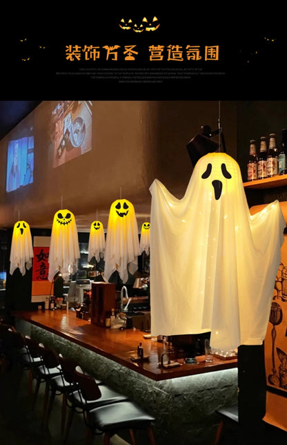 EtherealBe Halloween ghost pumpkin lamp hanging in a festive bar setting for spooky decor