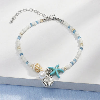 EtherealBe bohemian beach bracelet with shell charms and colorful beads for a coastal vibe