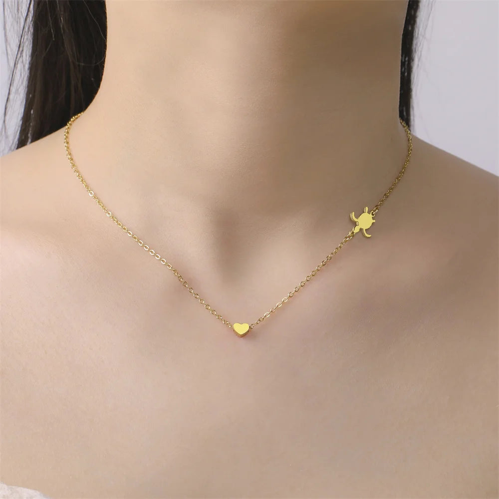 EtherealBe sea turtle pendant necklace for women featuring a gold chain and heart charm