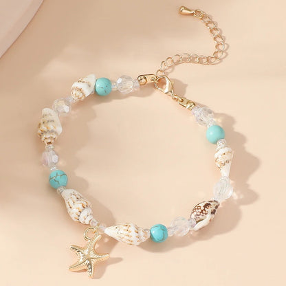 EtherealBe bohemian beach bracelet featuring shells, turquoise beads, and a starfish charm