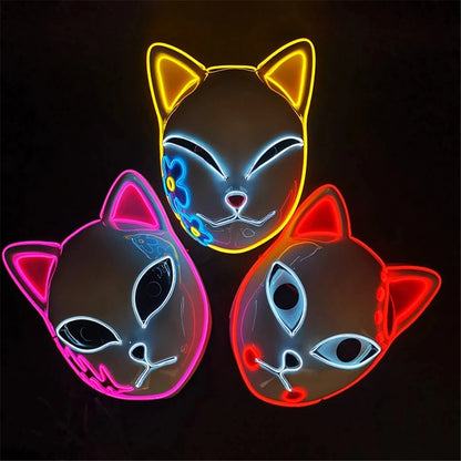 Three Halloween cat LED face masks in different colors with glowing designs for festive celebrations