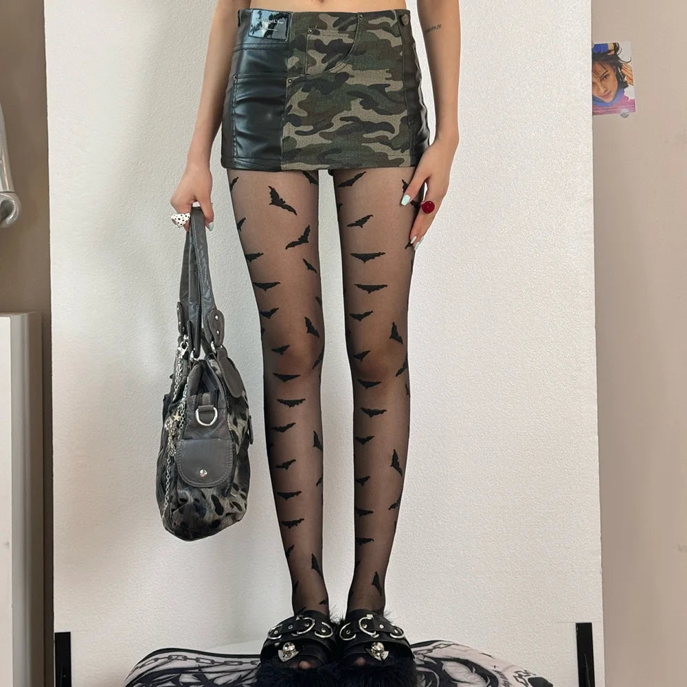 EtherealBe Halloween bat pattern tights for women styled with a camo skirt and chic accessories
