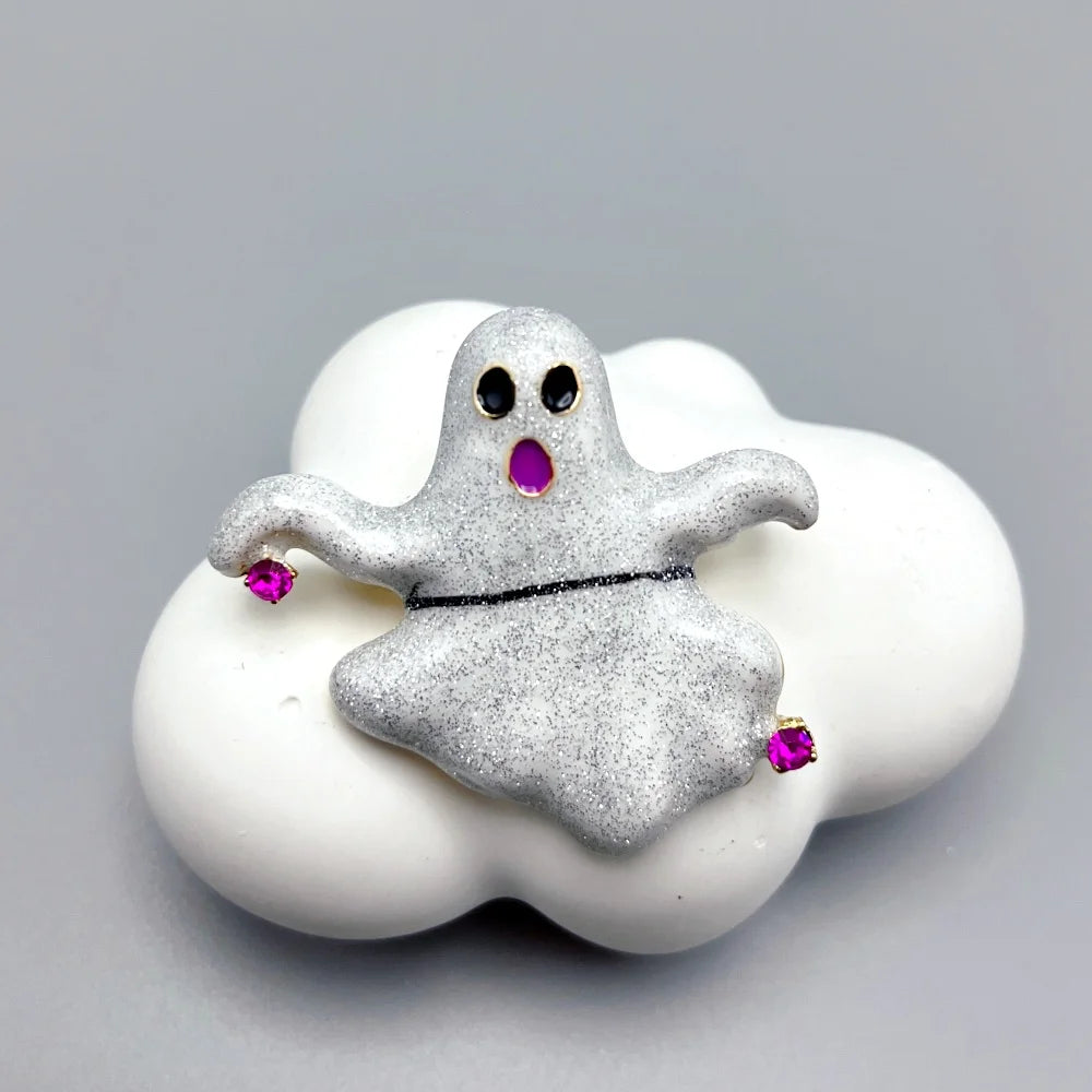 Cute ghost Halloween brooch pin with purple accents on a cloud background for festive style