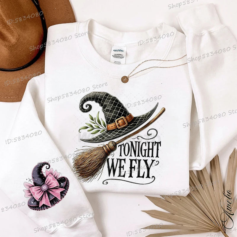 Women's Halloween witch hat sweatshirt featuring a whimsical design with the phrase Tonight We Fly