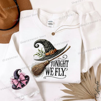 Women's Halloween witch hat sweatshirt featuring a whimsical design with the phrase Tonight We Fly
