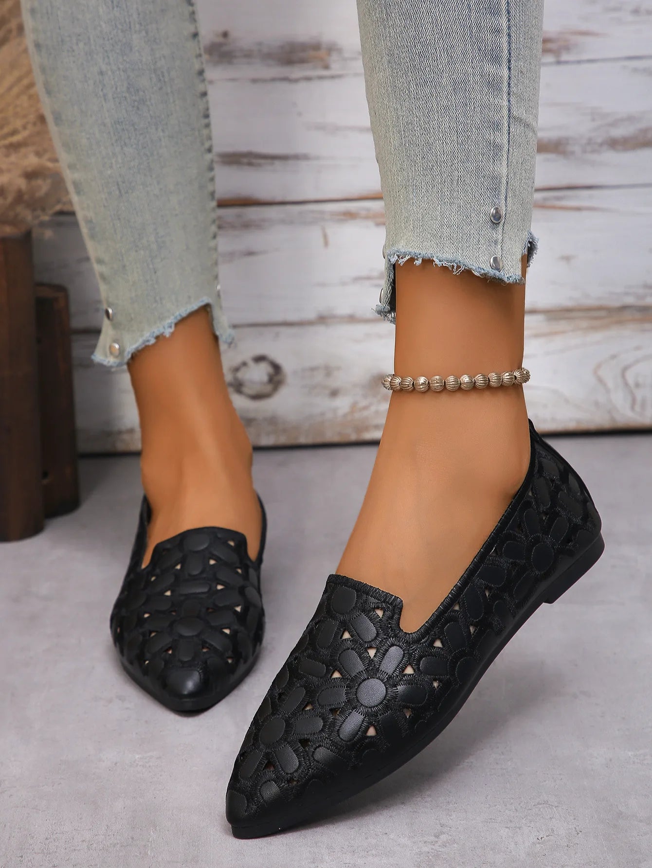 Black women's embroidered loafers with floral cutouts for stylish everyday wear