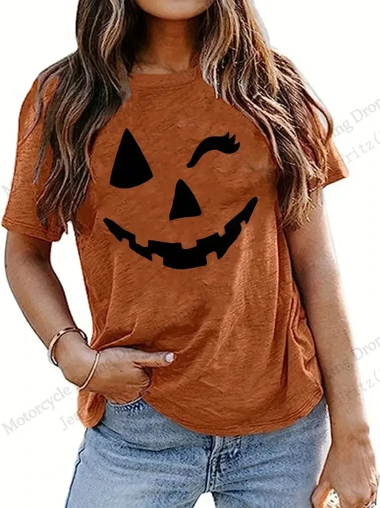 EtherealBe Halloween 3D print t-shirt women in orange with a smiling pumpkin face design