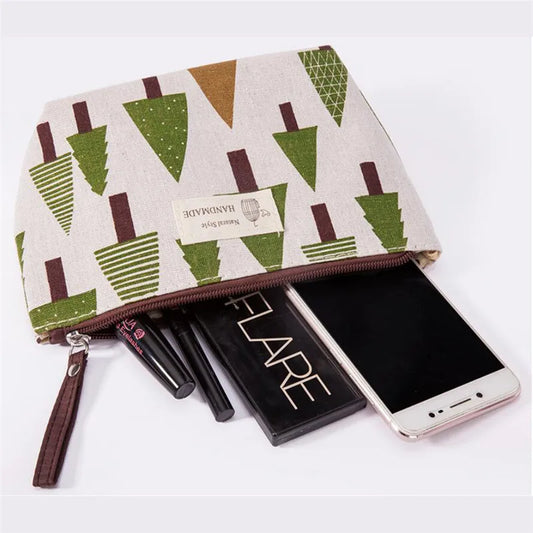 Stylish travel makeup bag for women with a tree pattern and space for cosmetics and mobile phone