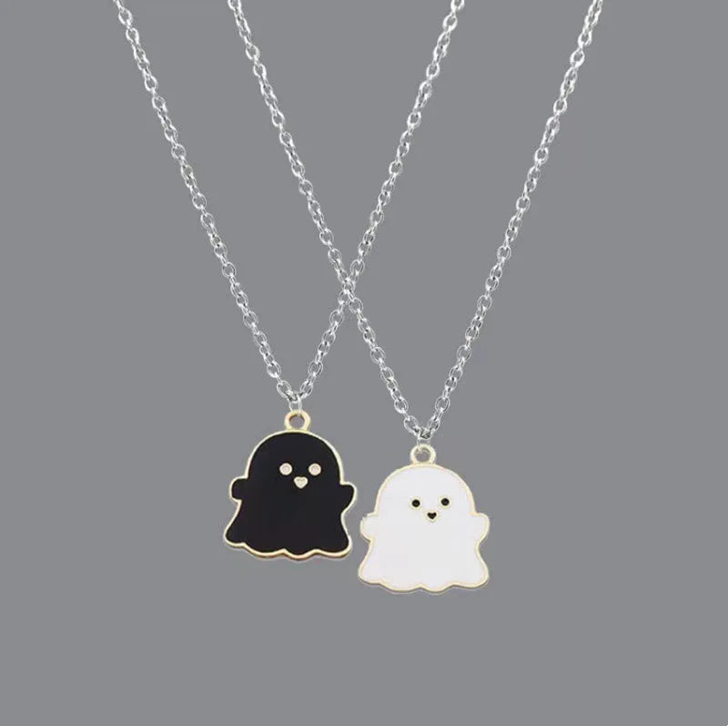 EtherealBe Halloween ghost pendant necklace featuring black and white ghost charms on silver chains