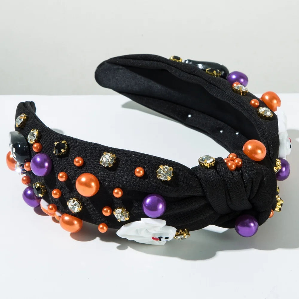 Black Halloween headband for women embellished with colorful pearls and spooky decorations