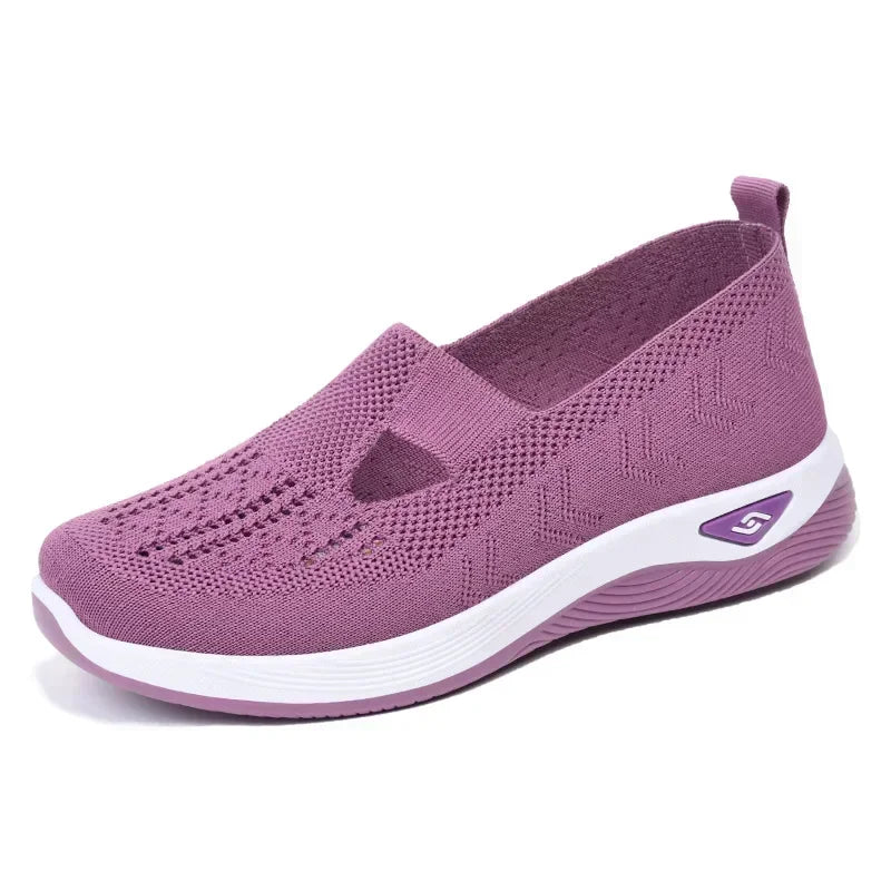 EtherealBe lightweight women's walking flats in purple with breathable knit design and cushioned sole