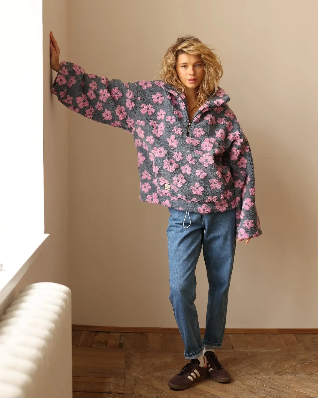 Cozy lambskin coat for women in a casual setting with floral patterns and relaxed fit