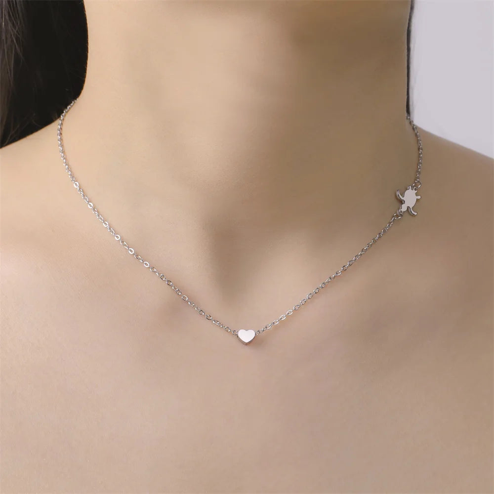 Delicate silver sea turtle pendant necklace for women featuring a heart design