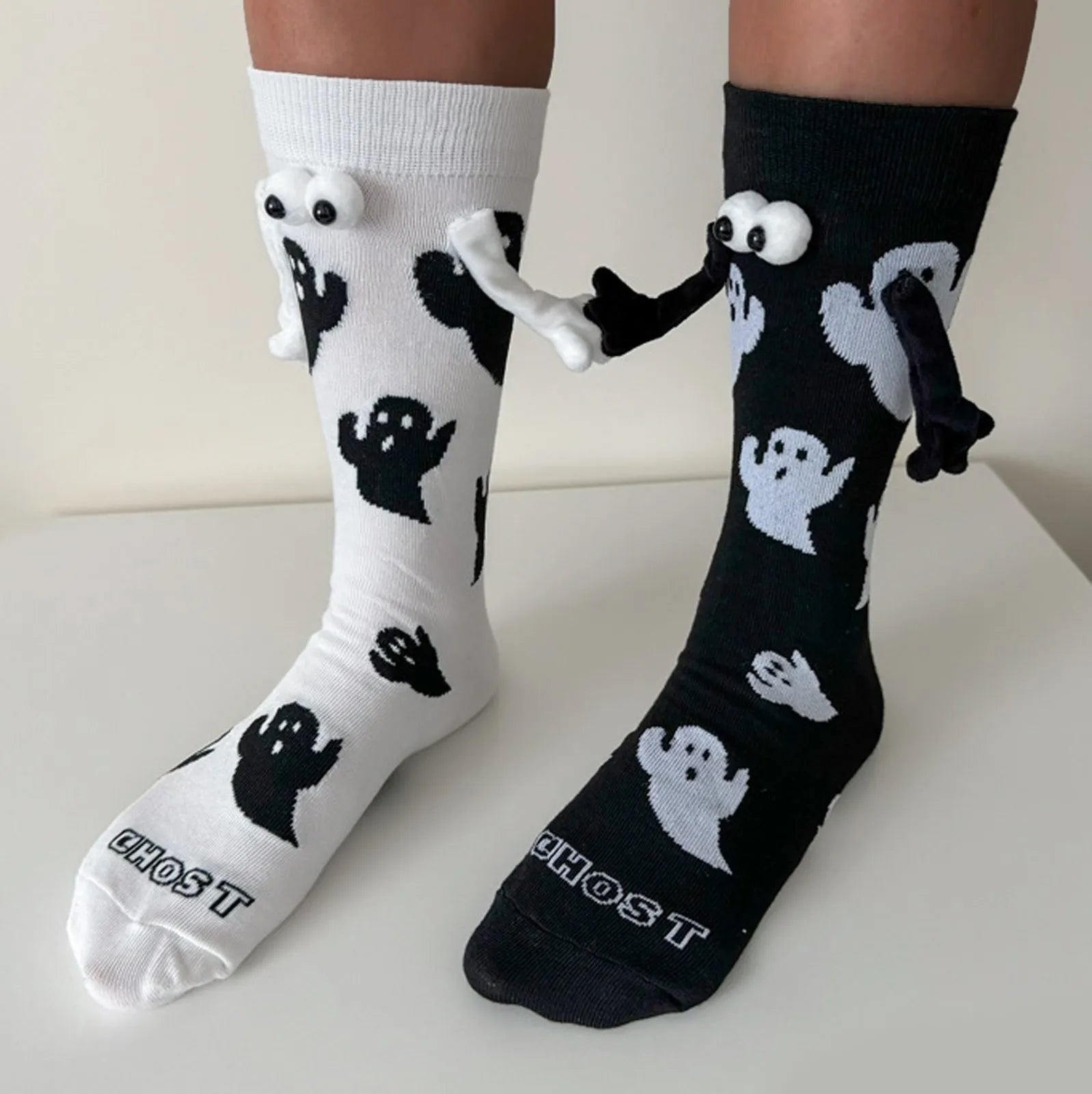 EtherealBe women Halloween socks featuring playful ghost designs in black and white