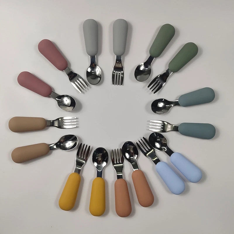 EtherealBe stainless steel baby utensils set featuring colorful silicone handles for easy gripping