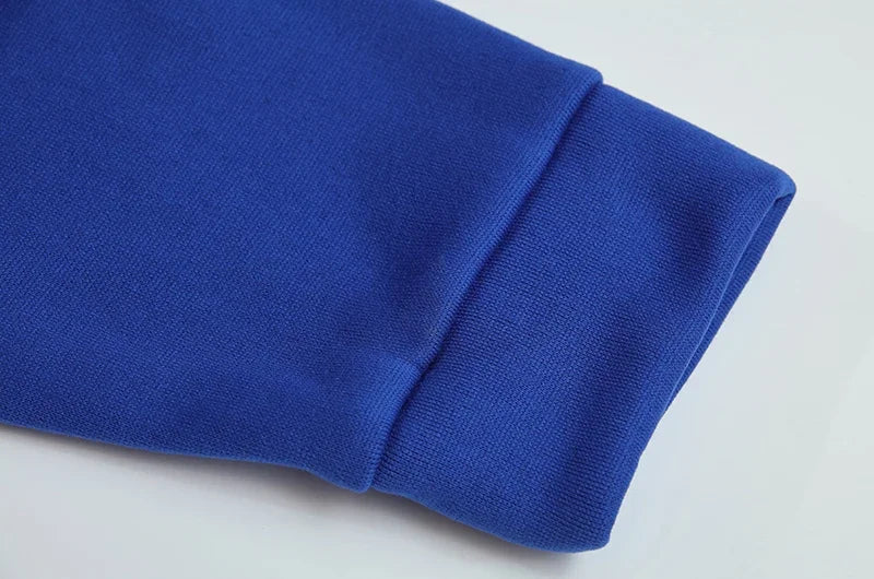 Close up of blue ribbed sleeve cuff on EtherealBe spider web zipper hoodie for women showing soft knit fabric