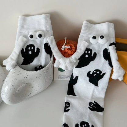 Cute women's Halloween socks featuring ghost designs and playful 3D eyes for festive style
