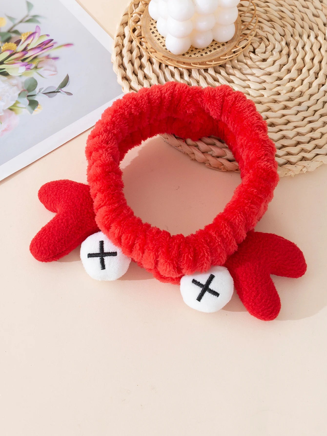 Cute cartoon crab spa headband in red with plush claws and white accents for a fun and cozy look