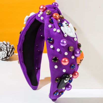 Fun purple Halloween headbands for women decorated with ghosts, pumpkins, and colorful beads