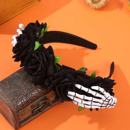 EtherealBe Halloween skeleton hand headband adorned with black roses and green leaves for spooky style