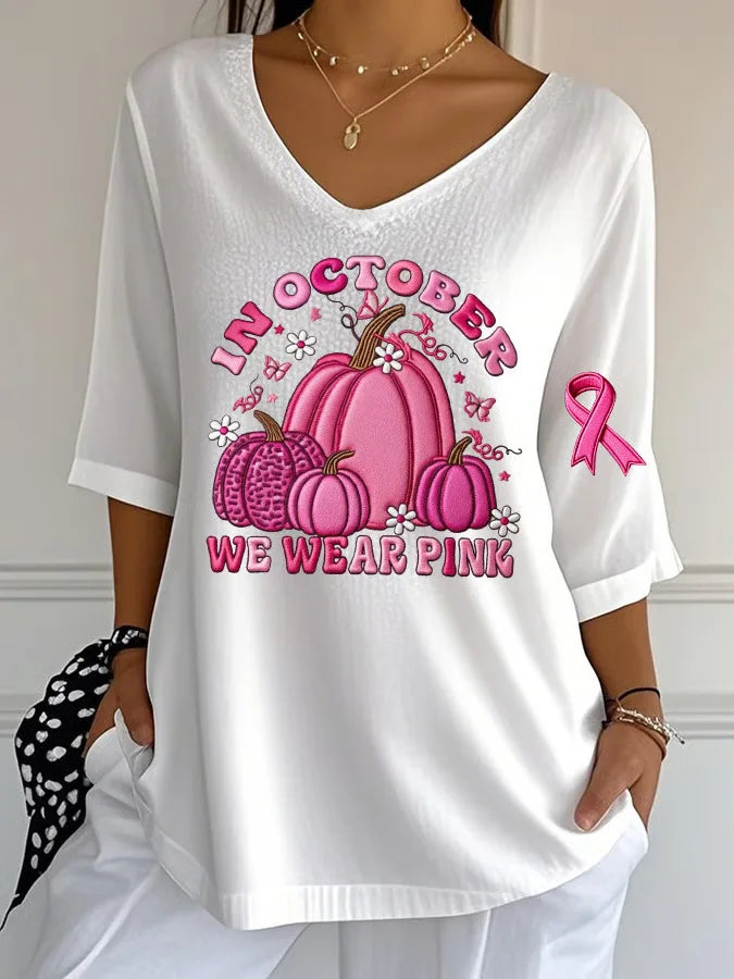 EtherealBe women's Halloween graphic t-shirt with pink pumpkins and message in October we wear pink