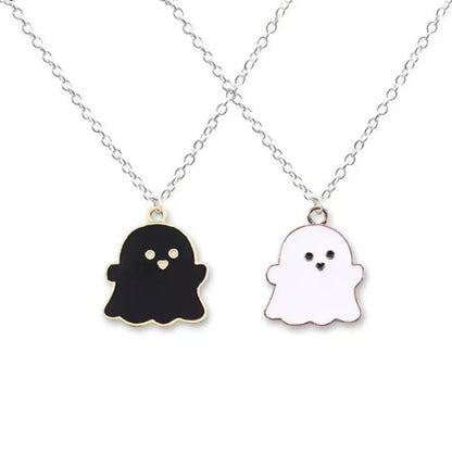 EtherealBe Halloween ghost pendant necklace with black and white ghost charms on a silver chain