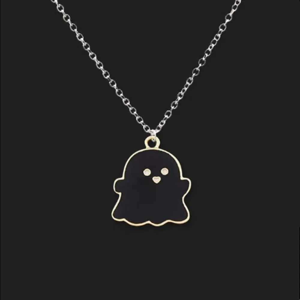 EtherealBe Halloween ghost pendant necklace in black with gold detailing on a silver chain