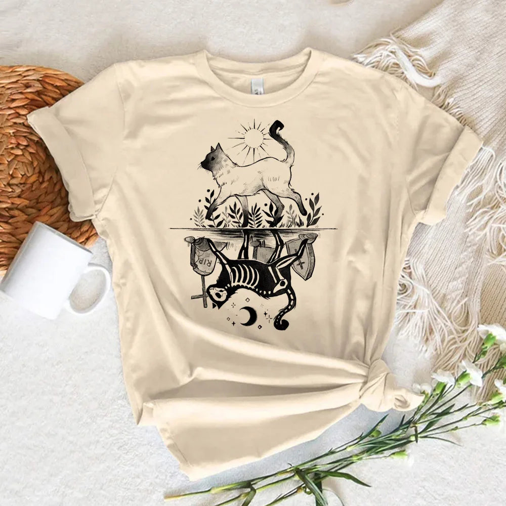EtherealBe Halloween witch shirt women featuring a playful cat and skeleton design on a cream base