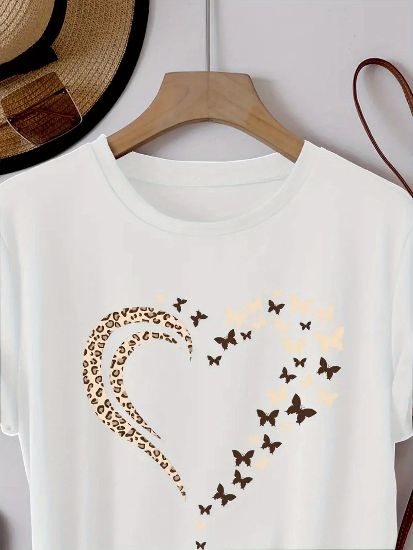 EtherealBe stylish women's heart print shirt featuring a unique butterfly design
