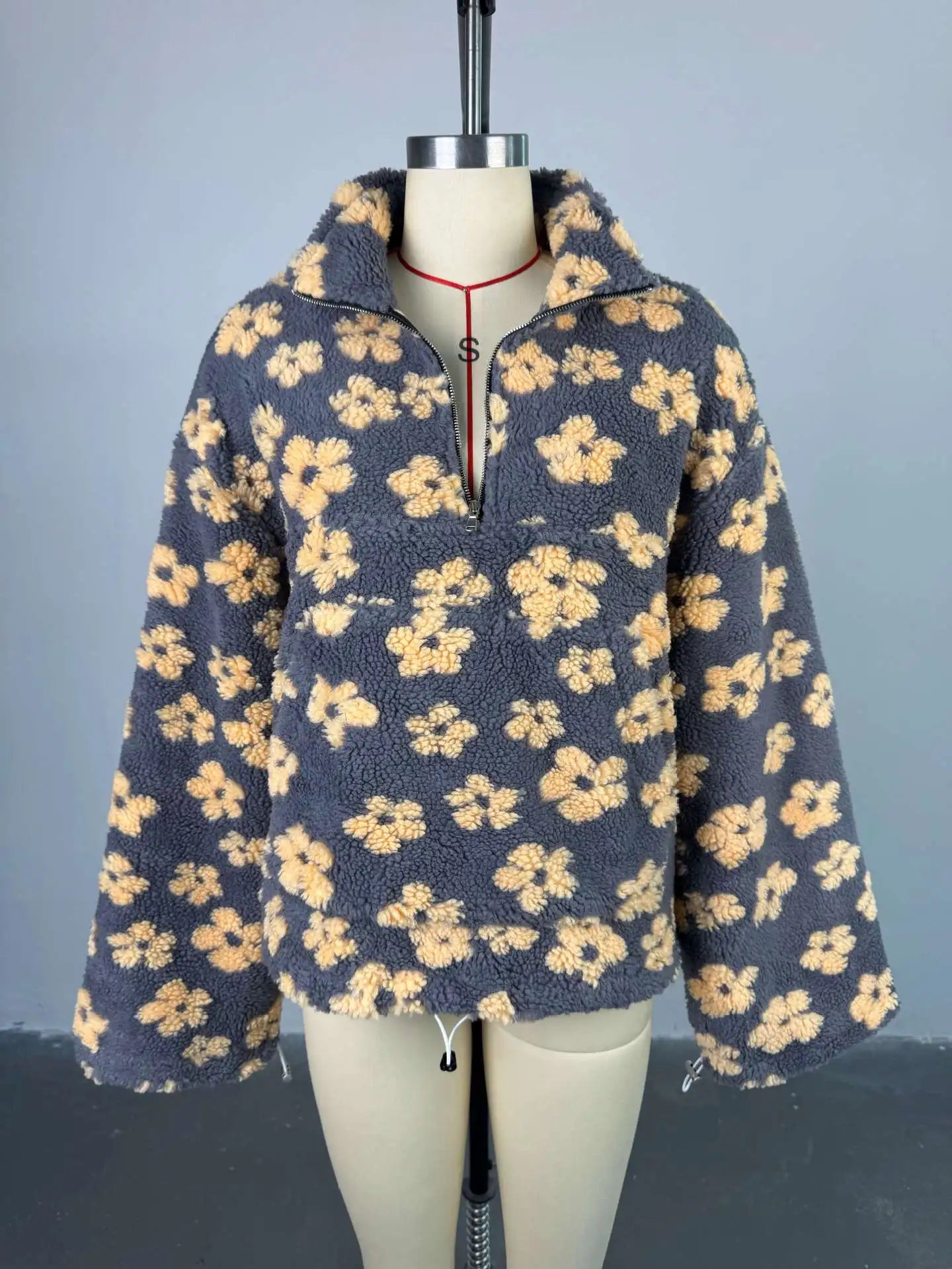 Soft and warm cozy lambskin coat for women featuring a flower pattern and oversized fit