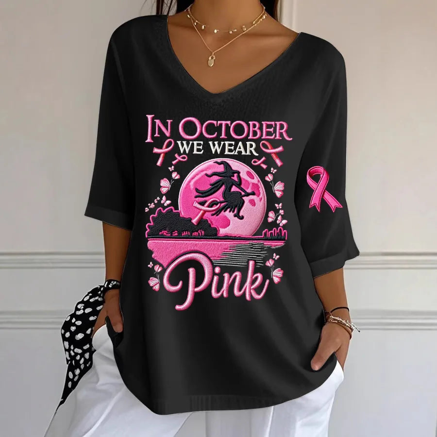 EtherealBe women's Halloween graphic t-shirt in black featuring a witch and pink ribbon design