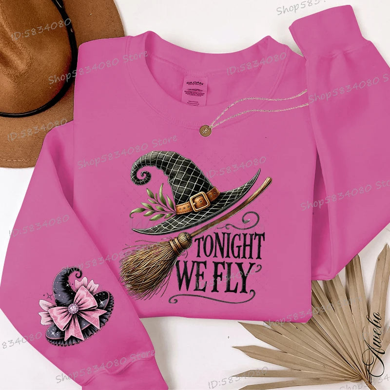 EtherealBe pink Halloween witch hat sweatshirt for women featuring a broom and 'Tonight We Fly' design