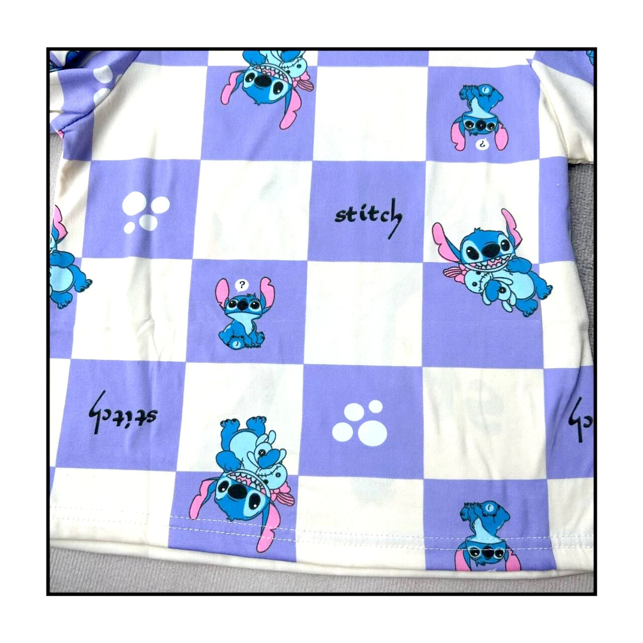 Children's Stitch pajamas set featuring colorful checkered design and playful Stitch characters