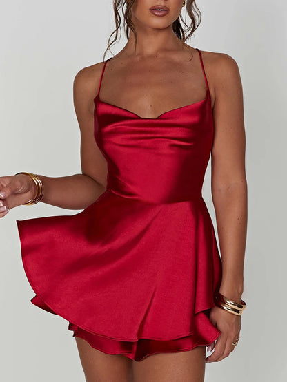 EtherealBe red satin silk backless cami romper with a flattering flared skirt design