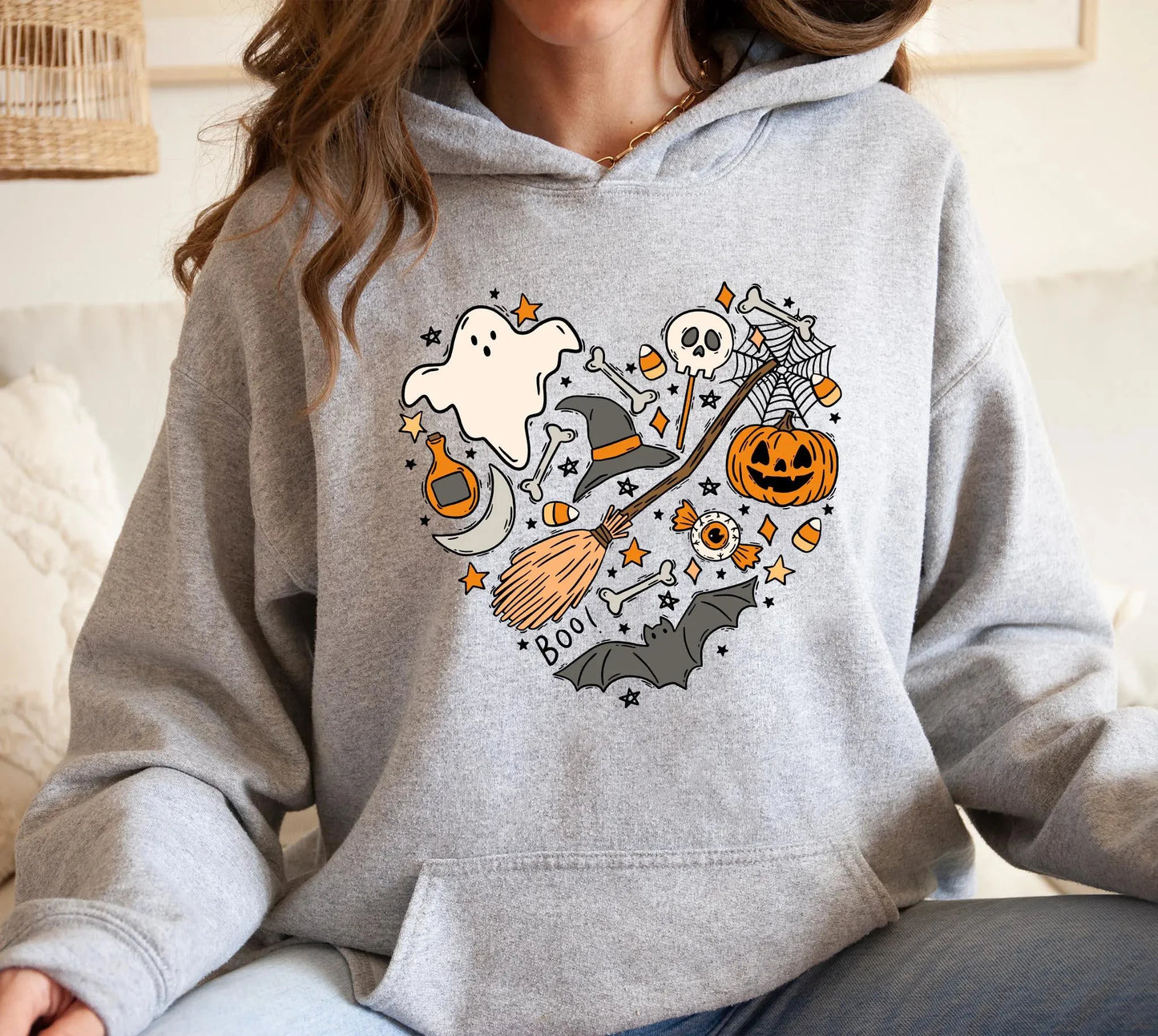 Cozy gray Halloween spooky hoodie for women featuring fun ghost and pumpkin graphics