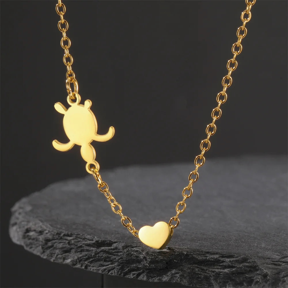 EtherealBe sea turtle pendant necklace for women featuring a gold chain and heart charm